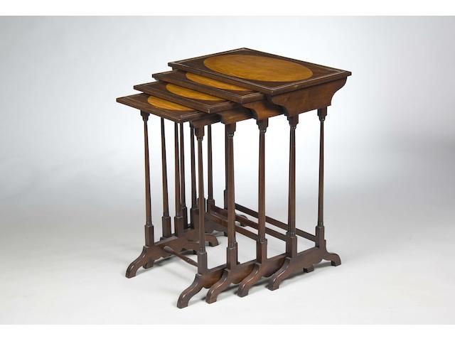 A nest of four mahogany quartetto tables