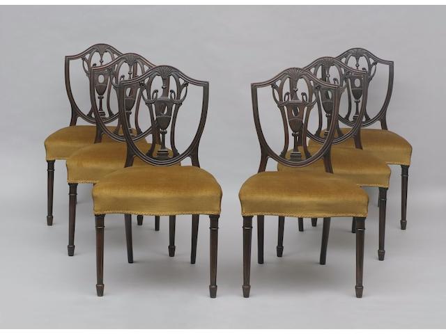 A set of six mahogany shield back dining chairs,