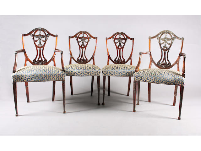 A set of twelve Adam revival carved mahogany dining chairs, circa 1900