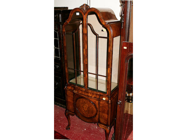 A Queen Anne style walnut display cabinet