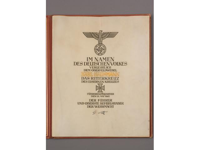 A Rare Formal Award Document Of A Knight's Cross to the Iron Cross Awarded to Oberfeldwebul Karl Hausmann