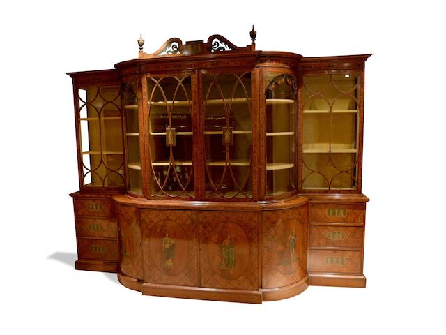 An impressive large Edwardian satinwood and polychrome decorated breakfront bookcase circa 1900
