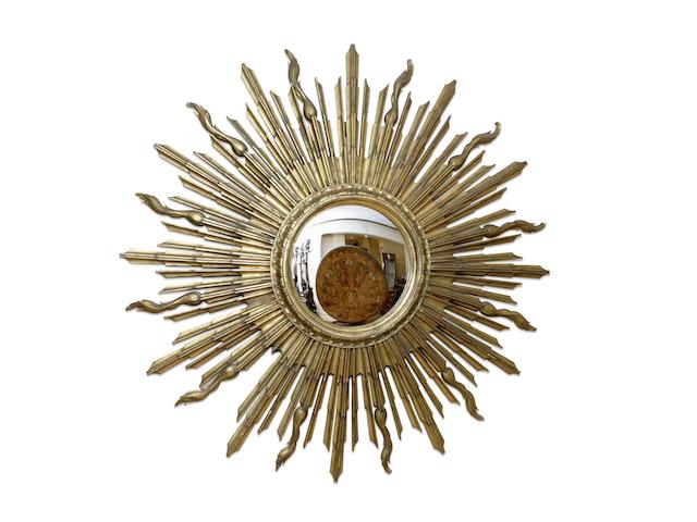 An early 20th century large carved giltwood sun burst convex mirror circa 1919