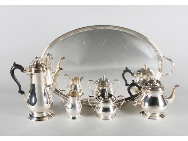 A silver four piece tea set and a twin handled tray By C J Vander Ltd, Sheffield, 1990-91,  (5)