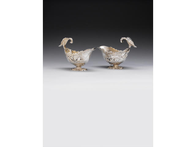 A pair of George III silver rococo revival sauce boats, by William Pitts, London 1814, also stamped with French tax mark,  (2)