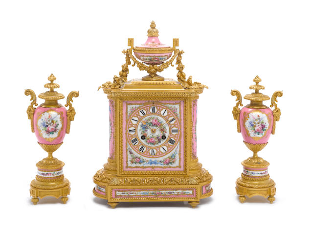 A late 19th century French ormolu and pink porcelain mantel clock garnture Retailed by John Poole, Jean-Baptiste Delettrez