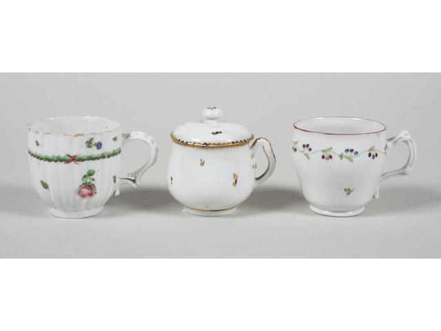 A Champion Bristol custard cup and cover and two Bristol coffee cups Early 19th Century
