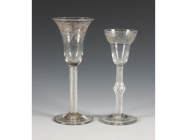 Two engraved air-twist wine glasses