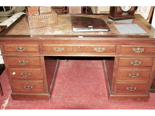 A late Victorian mahogany pedestal desk