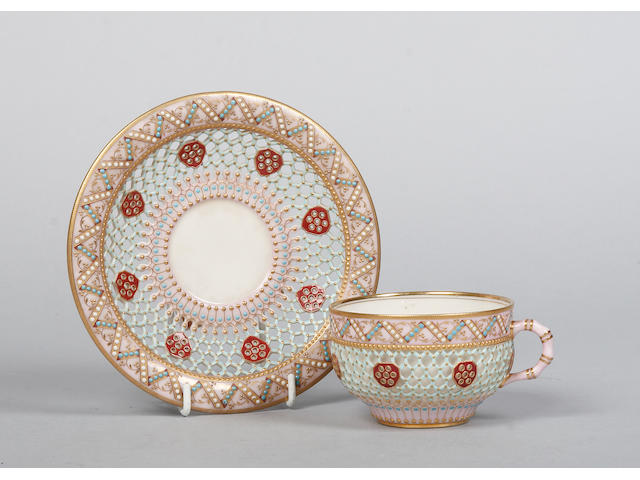 A reticulated and jewelled Worcester cabinet cup and saucer circa 1880