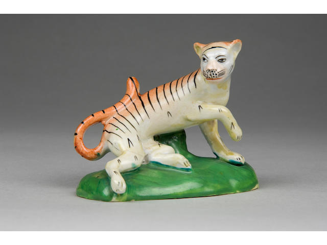 An important unrecorded Cambrian pottery model of a tiger circa 1820