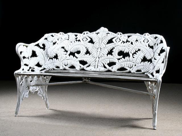 A pair of Victorian Coalbrookdale 'Fern & Blackberry' pattern cast-iron and wooden garden seats, circa 1870