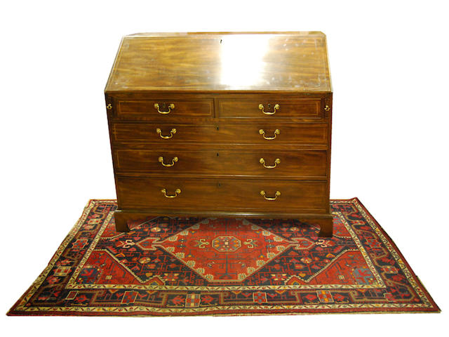 A large George III mahogany and boxwood-strung bureau