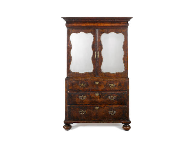An early 18th century and later walnut cabinet on chest