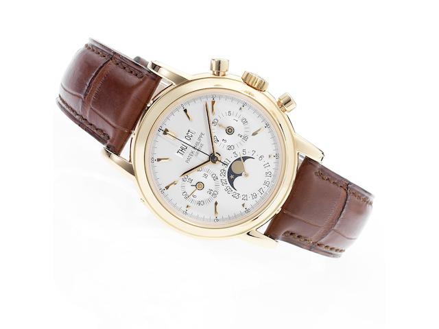 Patek Philippe. A fine and rare 18ct rose gold chronograph wristwatch with Patek Philippe strap, buckle and Extract from ArchivesRef.3970E, Movement No.3045928, Case No.4054377, Made in 1999, Sold June 16th 1999