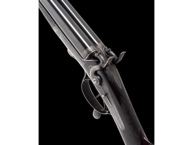 A fine and rare .450 (2&#190;in. Black Powder Express) hammer rifle by Sir J. Whitworth & Co. Ltd., No. 710