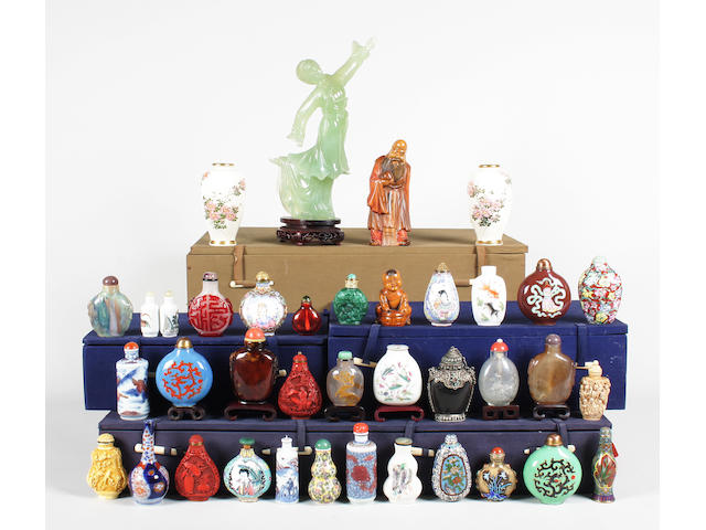 A collection of Chinese snuff bottles and stoppers, a carved hardstone figure, two carved hardwood figures and a small pair of Japanese Satsuma vases 20th Century.