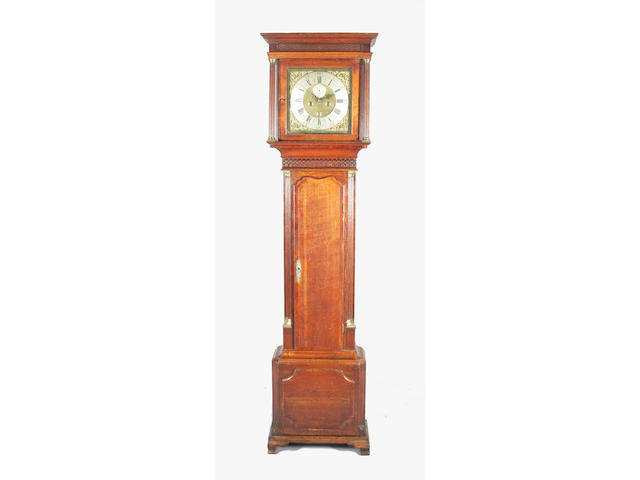 A George III oak and mahogany crossbanded longcase clock