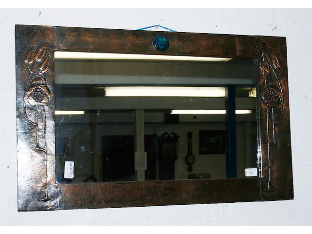 An Art Nouveau copper mirror