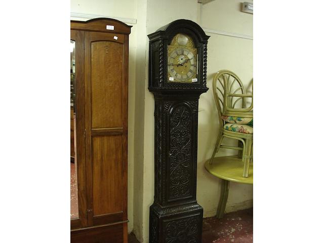 A carved oak cased eight day longcase clock J Chiltors, London