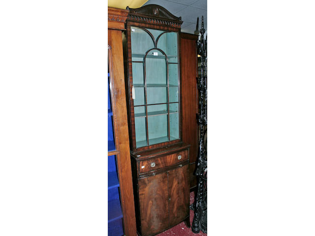 A good quality reproduction mahogany cupboard bookcase,