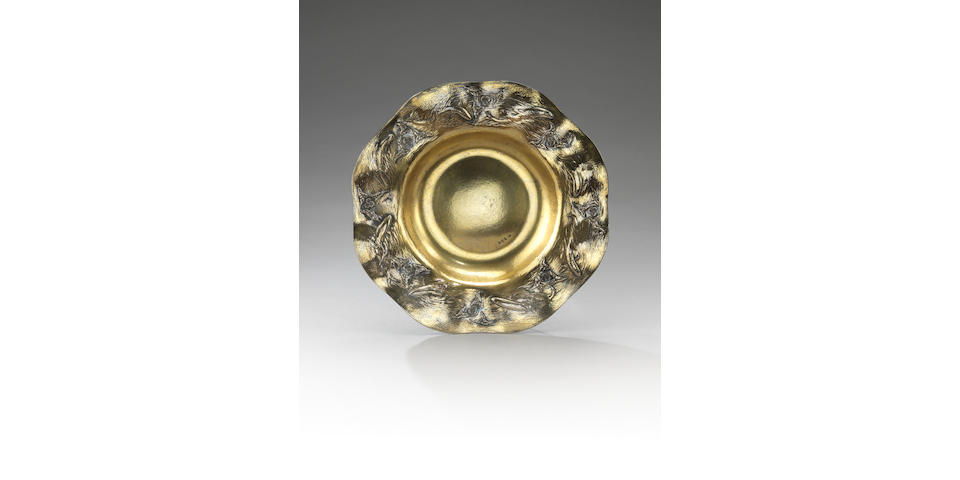 A late-Victorian Arts and Crafts Britannia standard silver-gilt side board or rose water dish, by Gilbert Marks, London 1899, also signed Gilbert Marks 1900,