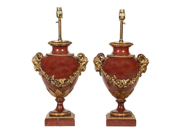 A pair of Louis XVI style rouge marble and gilt bronze urnsmounted as table lamps