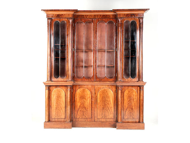An early Victorian inverted breakfront mahogany library bookcase