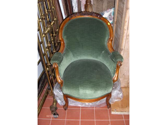 A Victorian style walnut three piece drawing room suite covered in green plush and on cabriole legs, comprising two seater settee and two armchairs.