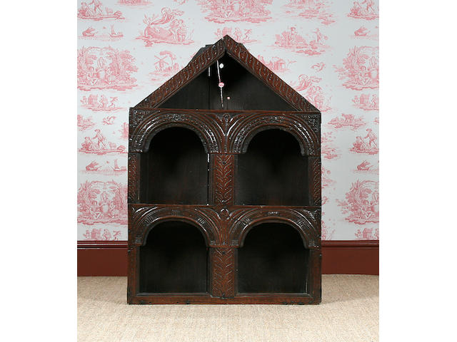 A mid 17th Century oak mural glass case of clout nail construction