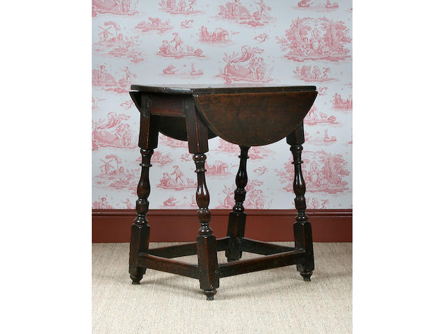 A mid 17th Century oak stool table, circa 1650