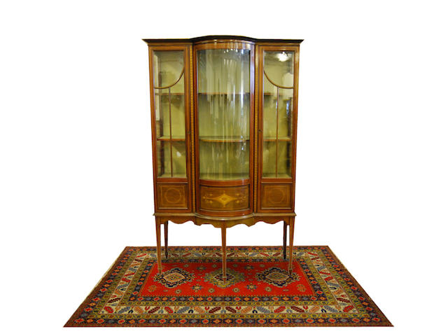 An Edwardian mahogany and inlaid bow-breakfront display cabinet