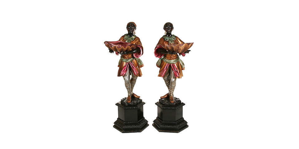 A pair of Venetian carved wood, gilded and polychrome decorated blackamoor figures