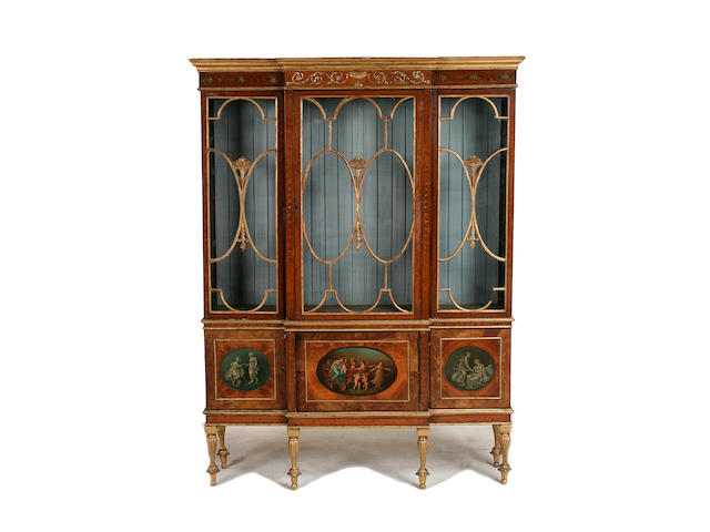 A good Sheraton style satinwood, parcel gilt and polychrome decorated display cabinet