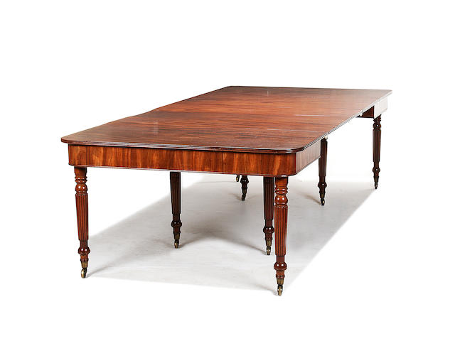 A Regency telescopic action mahogany dining table in the manner of Gillows