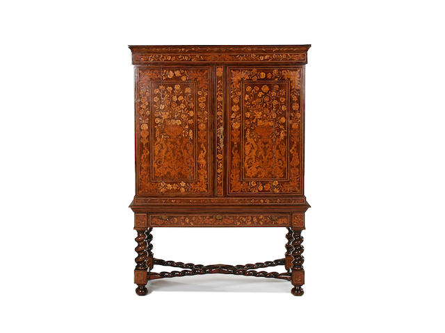A first half 19th century Dutch walnut and floral marquetry cabinet on stand