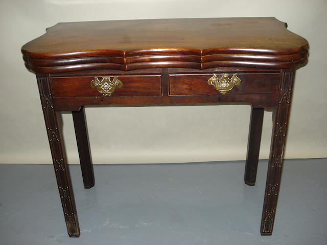 A George III mahogany triple foldover tea and games table, parts of later date, 86cm wide.