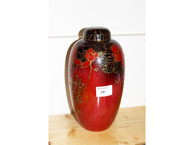 A Royal Doulton flambe coloured tall ovoid vase and cover