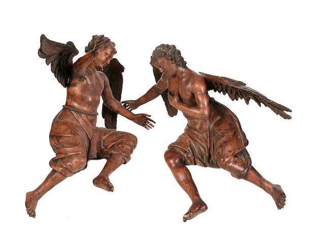 A pair of 19th century carved walnut figures of angels