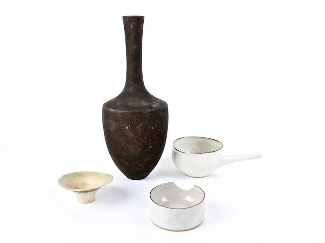 Three pieces by Lucie Rie and a vase in the style of Lucie Rie