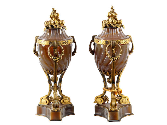 A pair of 19th Century French agate and ormulu mounted urns and covers