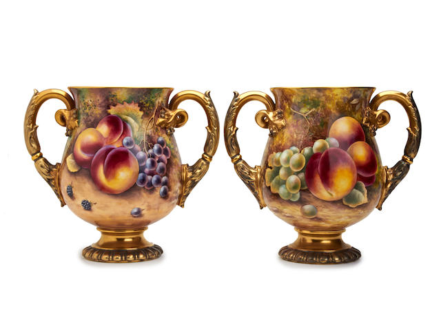 A pair of Royal Worcester fruit-painted twin handled vases, painted by James Skerritt and Terry Nutt Circa 1960-1970