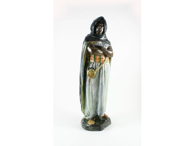 An unmarked Royal Doulton 'Moor' figure
