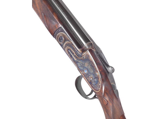A fine Smith-engraved 20-bore single-trigger over-and-under sidelock ejector gun by J. Purdey & Sons, no. 29705 In its leather case with canvas cover and accessories