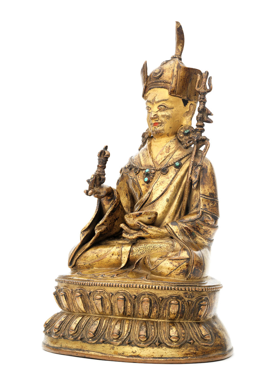 A gilt-copper figure of Padmasambhava Tibet, circa 15th century