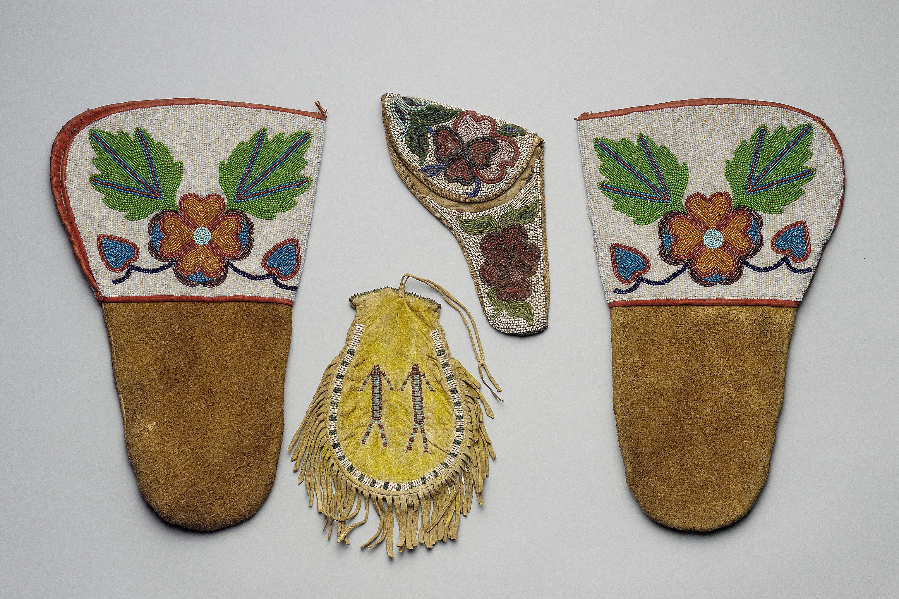 Plains hide pouch, beaded figures
