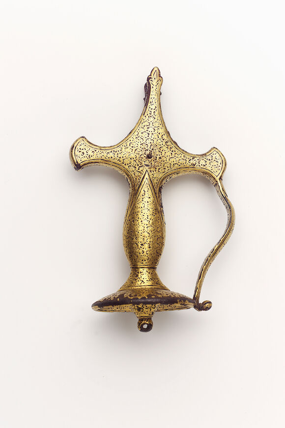 Bonhams : A gold koftgari steel Tulwar Hilt Mughal India, late 18th Century