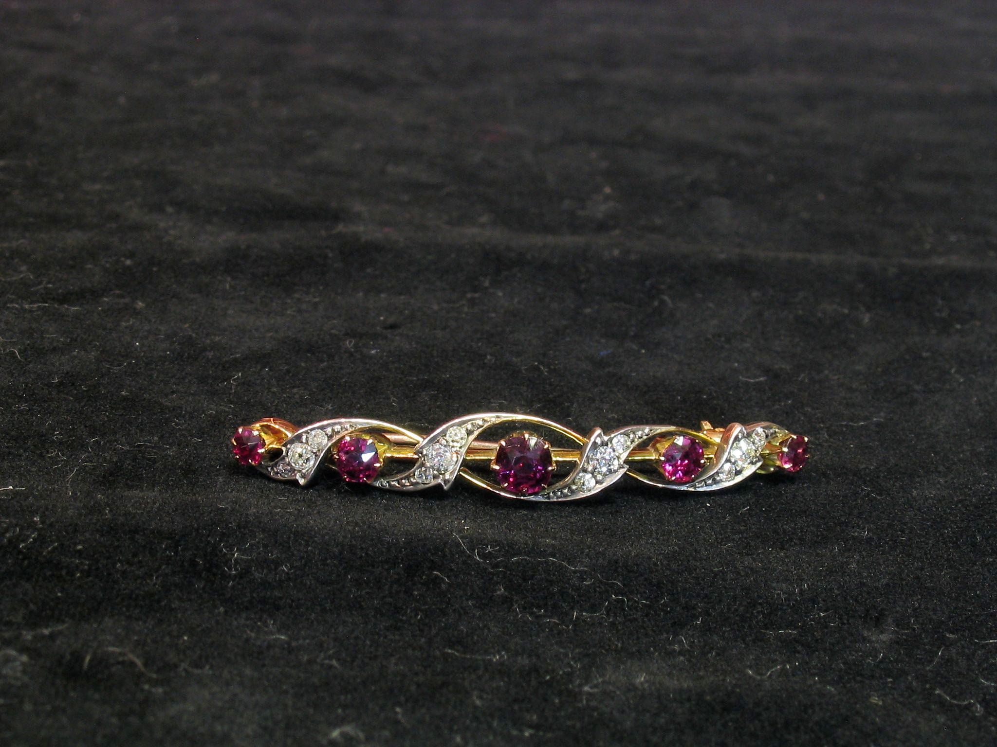 A ruby and diamond bar brooch