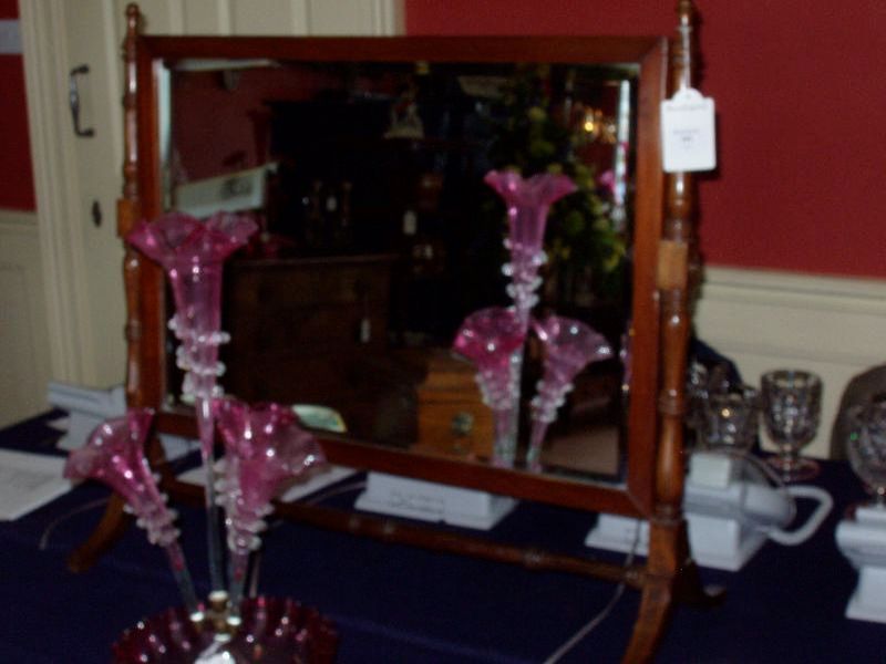 A mahogany rectangular toilet mirror,