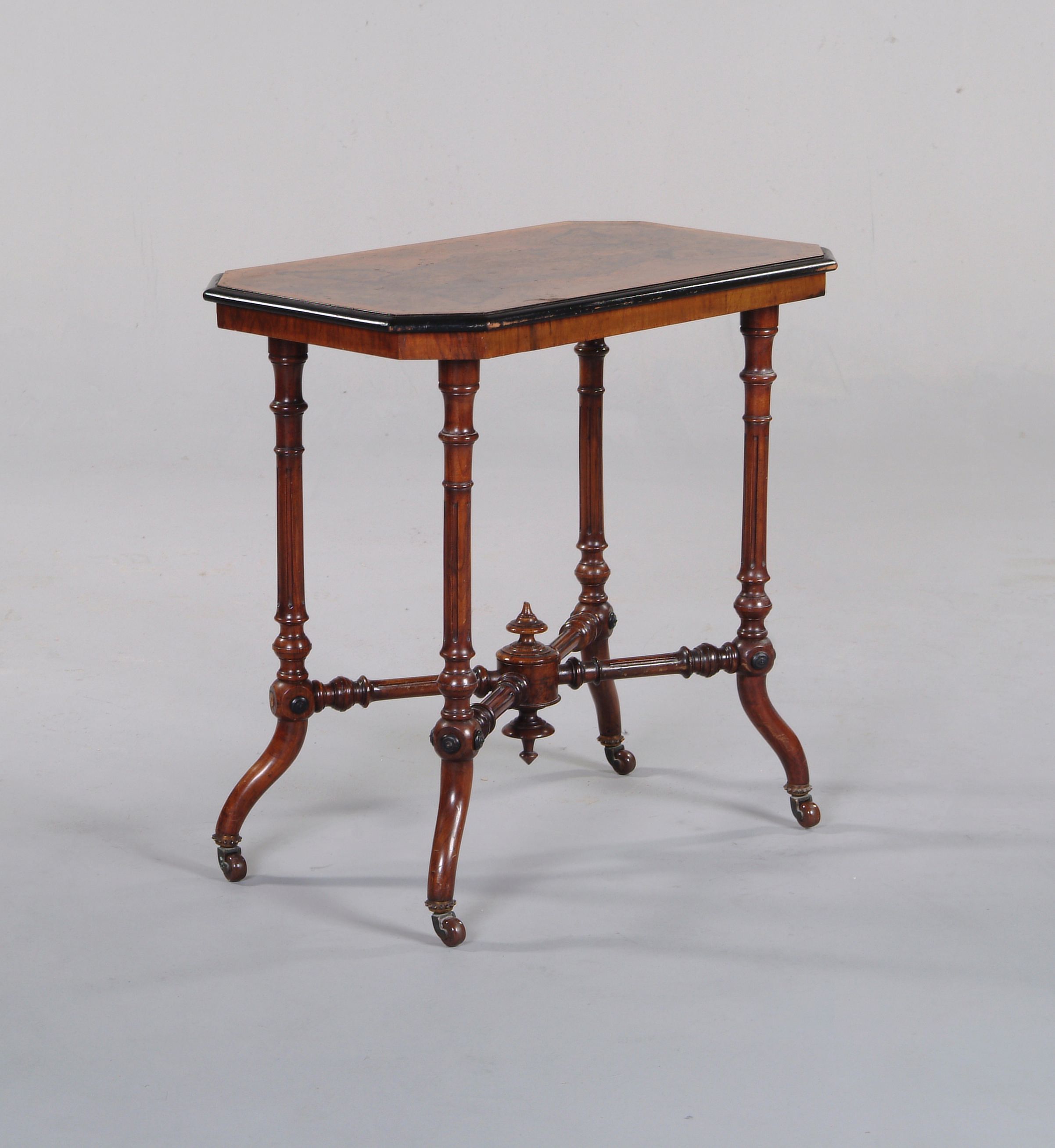 A Victorian walnut and ebonised centre table